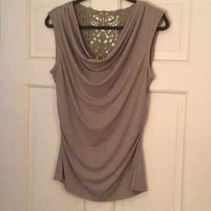 Beige shirt with decorative back.